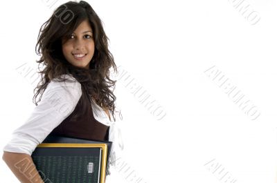 portrait of college student holding study material
