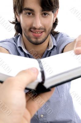 handsome man showing his diary handsome man showing his diary