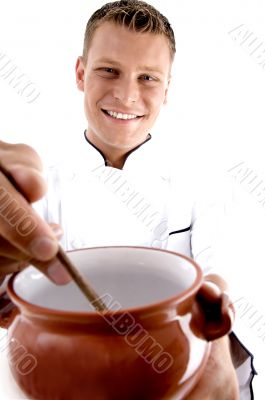 smart chef cooking in porcelain pot
