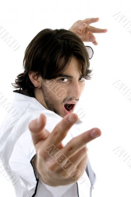 man in chef uniform performing karate stance