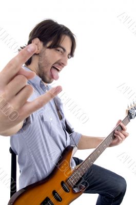 young rock star posing with guitar