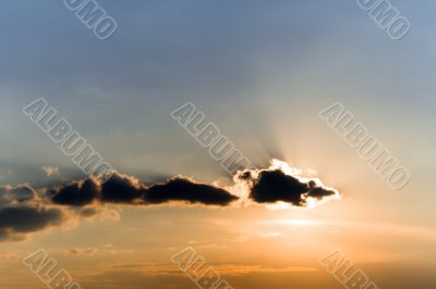 Clouds in sunset beams