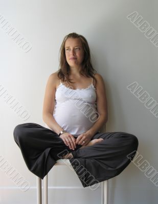 pregnant woman on a bed