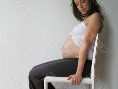 pregnant woman on a chair
