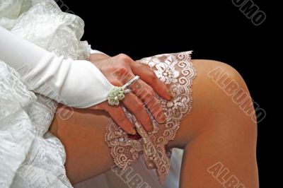 A bride on her garter on her leg