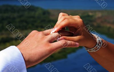 Wedding rings exchange between groom and bride
