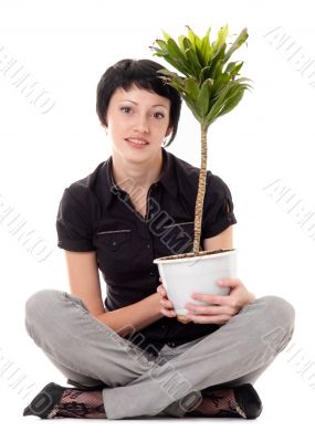 young woman with indoor plants