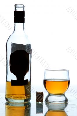 alcohol in bottle and glass on table