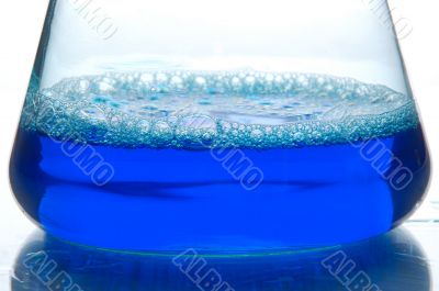 blue liquid in a retort