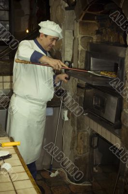 Cook cooking on the kitchen.