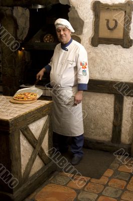 Cook cooking on the kitchen. Cook cooking on the kitchen.