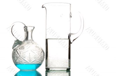 glass utensil with water and blue liquid glass utensil with water and blue liquid