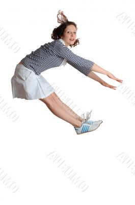 Happy energetic cute girl jumping into the air