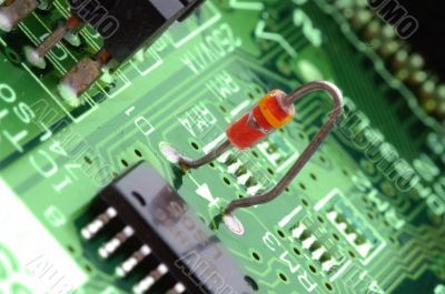 close-up chip on green motherboard