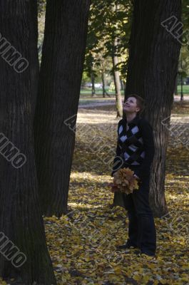 Woman walking in the autumn park