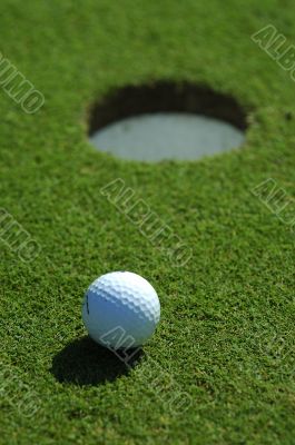 Golf ball close to the hole Golf ball close to the hole