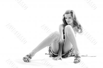 Beautiful woman sitting on floor.