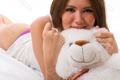 Beautiful smiling asian girl with a toy.