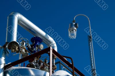 Industrial zone, Steel pipe-lines on blue sky