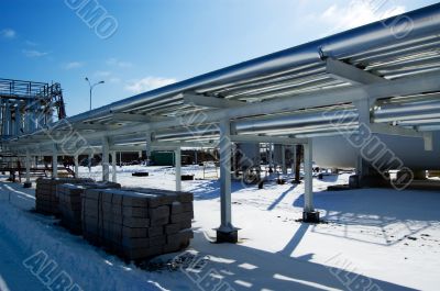 Industrial zone, Steel pipe-lines on blue sky