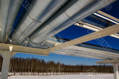 Industrial zone, Steel pipe-lines on blue sky