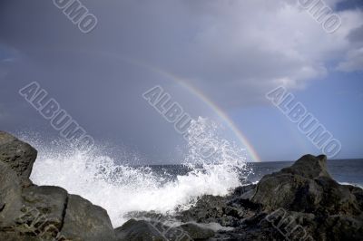 ocean waves and rainbow