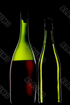 cognac and sparkling bottle on black