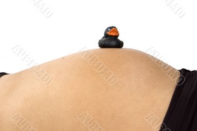 30 weeks pregnant teenager with black duck on her belly