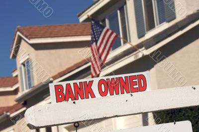 Bank Owned Real Estate Sign and House with American Flag