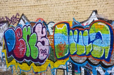 Many-colored letters on the fence