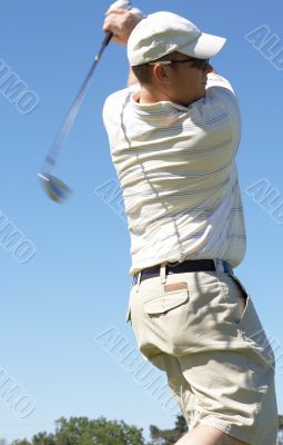 Golfer hitting the ball