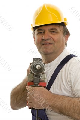 Worker with drilling machine and safety helmet Worker with drilling machine and safety helmet