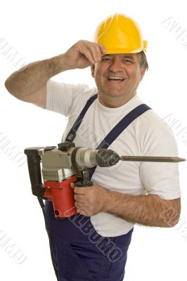 Worker with drilling machine and safety helmet