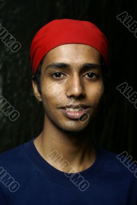 Indian man with red headwear