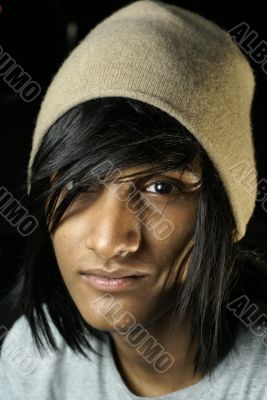 Man with beanie and pageboy hairstyle