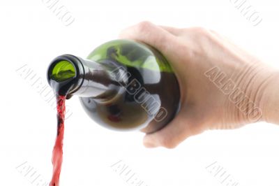 Open wine bottle in hand