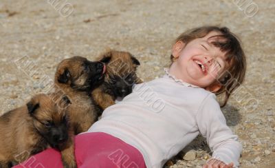 laughing girl and puppies