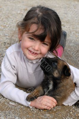 girl and puppy