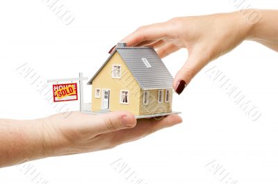 Reaching For A Home with Sold Real Estate Sign