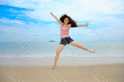 happy fun jump at the beach