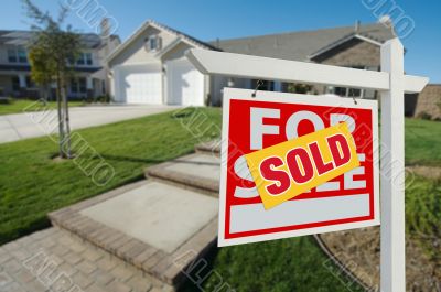 Sold Home For Sale Sign and House