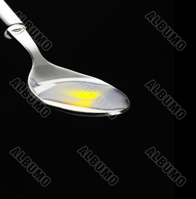 olive oil on a spoon