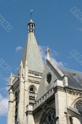 French church belltower on the blue sky background