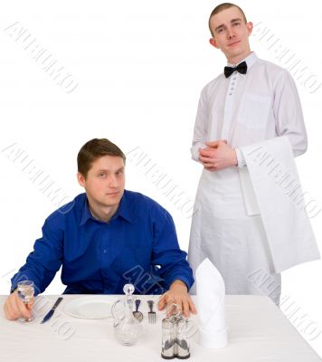 Waiter and guest of restaurant