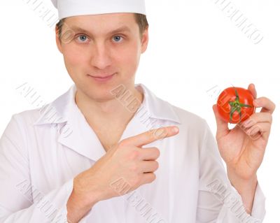 Cook with tomato in hand