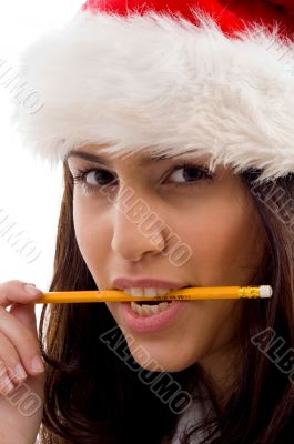 female wearing christmas hat holding pencil female wearing christmas hat holding pencil