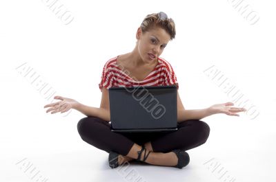 sitting woman holding laptop