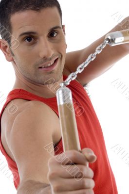 smiling male showing nunchaku