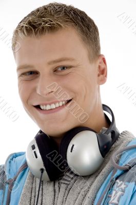 man with headphones around his neck man with headphones around his neck