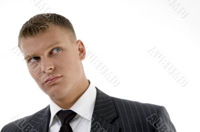 close up of handsome businessman looking upward